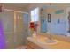 Clean bathroom with a glass-enclosed shower and updated fixtures at 6950 Se 124Th Ln, Belleview, FL 34420