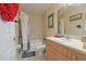 Well-maintained bathroom with tub and shower combo and a modern vanity at 6950 Se 124Th Ln, Belleview, FL 34420