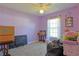 Bedroom with carpeted flooring and a window providing natural light at 6950 Se 124Th Ln, Belleview, FL 34420