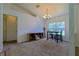 Dining area features a chandelier, a breakfast bar and a large window at 6950 Se 124Th Ln, Belleview, FL 34420