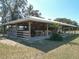 Horse barn with stalls and covered shelter, ideal for equestrian enthusiasts at 7688 Se 135Th St, Summerfield, FL 34491