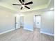 A bright bedroom features a ceiling fan, recessed lighting, and neutral paint at 8295 Se 159Th Ln, Summerfield, FL 34491