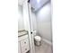 The toilet room features gray wood laminate floors, neutral paint and recessed lighting at 8295 Se 159Th Ln, Summerfield, FL 34491