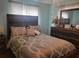 Serene bedroom with a large bed, coordinated bedding, and a wooden dresser at 8481 Sw 107Th Pl, Ocala, FL 34481