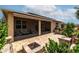 Brick-paved back patio featuring a screened-in porch, sitting area, and a built-in fire pit at 8532 Sw 79Th Ave, Ocala, FL 34481