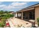 Serene backyard featuring a paver patio, a built-in fire pit, and a screened-in porch for outdoor relaxation at 8532 Sw 79Th Ave, Ocala, FL 34481