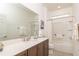 Bright bathroom with a vanity, mirror, and walk-in shower at 8532 Sw 79Th Ave, Ocala, FL 34481