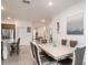 Bright dining room featuring a modern table with seating for six and stylish decor at 8532 Sw 79Th Ave, Ocala, FL 34481