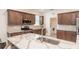 Kitchen featuring stainless appliances and granite countertops, with an adjacent laundry room at 8532 Sw 79Th Ave, Ocala, FL 34481