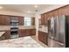 Kitchen featuring stainless appliances, granite countertops, and access to laundry room at 8532 Sw 79Th Ave, Ocala, FL 34481