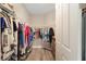 A walk-in closet offers ample storage with clothing racks and shelving at 8874 Sw 104Th Cir, Ocala, FL 34481