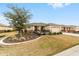 Inviting single-story home featuring well-kept landscaping, an attached two-car garage, and a cozy front porch at 8874 Sw 104Th Cir, Ocala, FL 34481