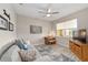 Cozy living room featuring a ceiling fan, light gray walls, modern furnishings, and lots of natural light at 8874 Sw 104Th Cir, Ocala, FL 34481