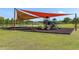 Community playground with slides and covered seating at 8874 Sw 104Th Cir, Ocala, FL 34481