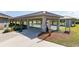 A shuffleboard court with adjacent covered seating areas for residents at 8874 Sw 104Th Cir, Ocala, FL 34481