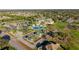 An aerial view of the community clubhouse, pool, bocce ball court, and golf course at 9033 Se 136Th Loop, Summerfield, FL 34491