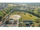 Scenic aerial view of the community ball field and surrounding neighborhood at 9033 Se 136Th Loop, Summerfield, FL 34491