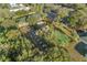 Overhead view of the community park featuring a basketball court, seating, and lush landscaping at 9033 Se 136Th Loop, Summerfield, FL 34491