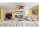 Relaxing living room with hardwood floors, inviting seating, and a seamless transition to the outdoor lanai at 9126 Sw 102Nd Cir, Ocala, FL 34481