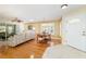 Cozy living room and dining area with hardwood floors and natural light at 9126 Sw 102Nd Cir, Ocala, FL 34481