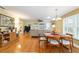 Bright living room with hardwood floors, a ceiling fan, and a view to the backyard at 9126 Sw 102Nd Cir, Ocala, FL 34481