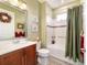 This bathroom offers a bathtub, shower, and cherry wood cabinets at 9399 Sw 106Th Ave, Ocala, FL 34481