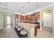 Spacious kitchen island with granite countertops, pendant lighting, and stainless steel appliances at 9399 Sw 106Th Ave, Ocala, FL 34481