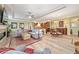 Open-concept living room with wood-look floors and combined living, kitchen and dining area at 9399 Sw 106Th Ave, Ocala, FL 34481