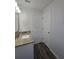 Bathroom with granite countertop, sink, and nearby closet at 96 Fisher Way Trl, Ocklawaha, FL 32179