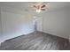 Well-lit bedroom features hardwood floors and a large closet at 96 Fisher Way Trl, Ocklawaha, FL 32179