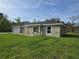 Charming single-story home featuring a front-facing garage and a well-manicured lawn at 96 Fisher Way Trl, Ocklawaha, FL 32179