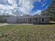 Attractive single-story home with attached garage and neat front lawn at 96 Fisher Way Trl, Ocklawaha, FL 32179