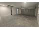 A full view of a two car garage with garage door and lighting at 96 Fisher Way Trl, Ocklawaha, FL 32179