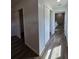 Hallway featuring two closets and access to the main bathroom at 96 Fisher Way Trl, Ocklawaha, FL 32179