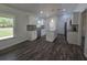 Well-lit kitchen showcasing granite counters, stainless steel appliances, and ample cabinet space at 96 Fisher Way Trl, Ocklawaha, FL 32179
