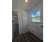 Bright laundry room with hookups, window and access to the rest of the home at 96 Fisher Way Trl, Ocklawaha, FL 32179
