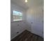 Well lit laundry room with a window next to the washer and dryer hookups at 96 Fisher Way Trl, Ocklawaha, FL 32179