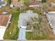 Aerial view of a home highlighting the roof, landscaping, and surrounding neighborhood at 9661 Se 173Rd Pl, Summerfield, FL 34491