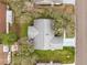 Overhead view of a property showcasing its layout, roof, and surrounding greenery at 9661 Se 173Rd Pl, Summerfield, FL 34491