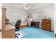 Bedroom featuring carpet floor, ceiling fan, sofa and desk at 9661 Se 173Rd Pl, Summerfield, FL 34491