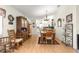 Inviting dining room with laminate floors and a view of the adjacent kitchen at 9661 Se 173Rd Pl, Summerfield, FL 34491