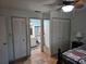 Bedroom with closet and attached bathroom featuring white vanity and tile flooring at 10831 Se 50Th Ter, Belleview, FL 34420