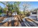 Home's backyard featuring a basketball hoop, shed, playset and lawn at 1126 Ne 34Th Ave, Ocala, FL 34470