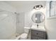 Bathroom features a walk-in shower, modern vanity, updated fixtures and tiled floor at 1126 Ne 34Th Ave, Ocala, FL 34470