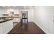 Well-lit kitchen featuring dark wood floors, granite countertops, and stainless steel appliances at 1126 Ne 34Th Ave, Ocala, FL 34470