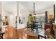 Dining area with round table, wooden chairs, and view into the entryway at 11593 Sw 75Th Cir, Ocala, FL 34476