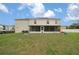 Large screened-in porch overlooking the backyard with lush green grass at 11684 Sw 56Th Ter, Ocala, FL 34476