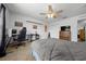 Bedroom with large window, ceiling fan, and neutral carpet at 11684 Sw 56Th Ter, Ocala, FL 34476