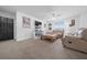 Cozy living room with carpeting, a ceiling fan, and comfortable seating at 11684 Sw 56Th Ter, Ocala, FL 34476