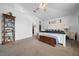 Spacious main bedroom featuring an ensuite bath, ceiling fan, and storage at 11684 Sw 56Th Ter, Ocala, FL 34476